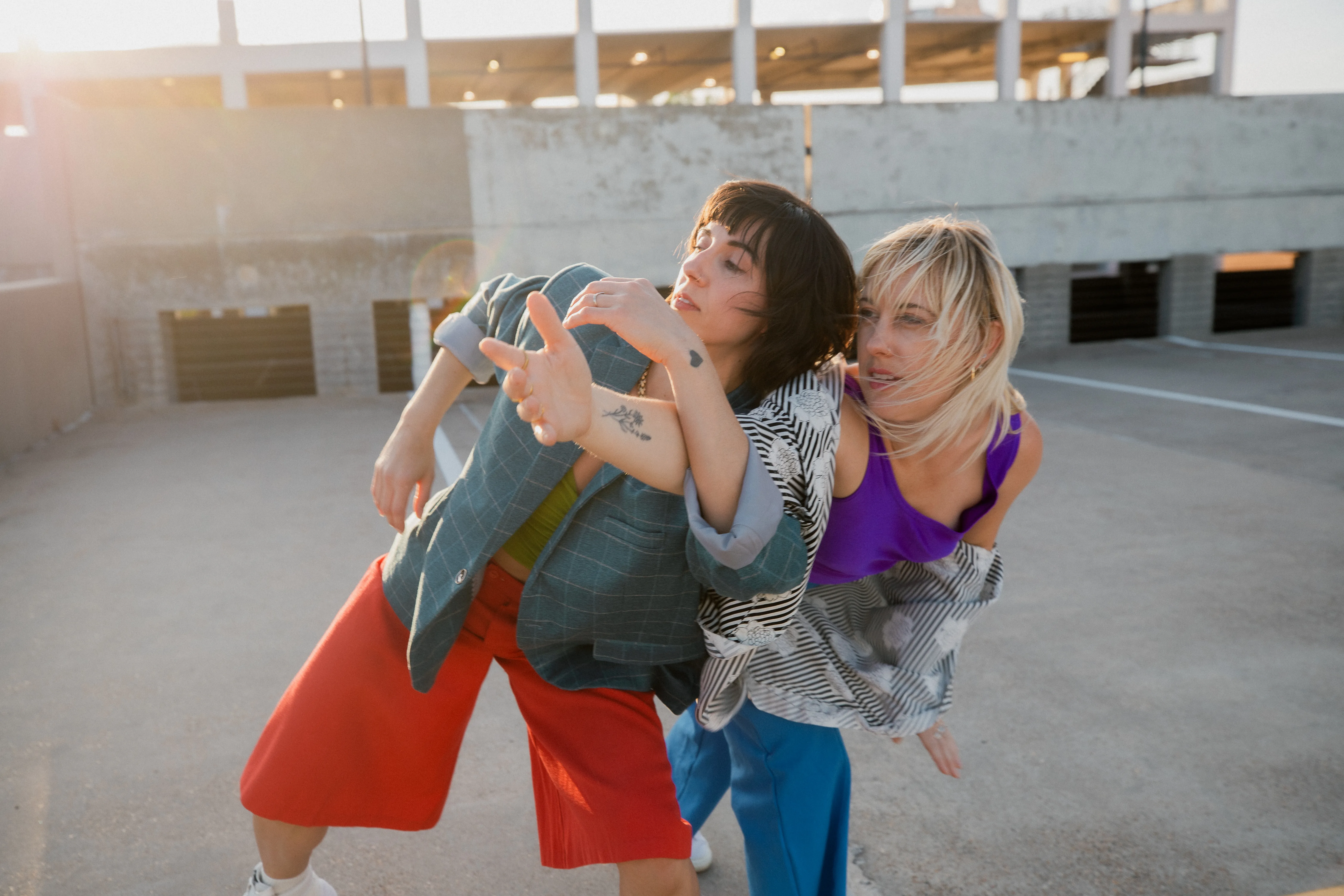 Dancers on an Austin rooftop at golden hour